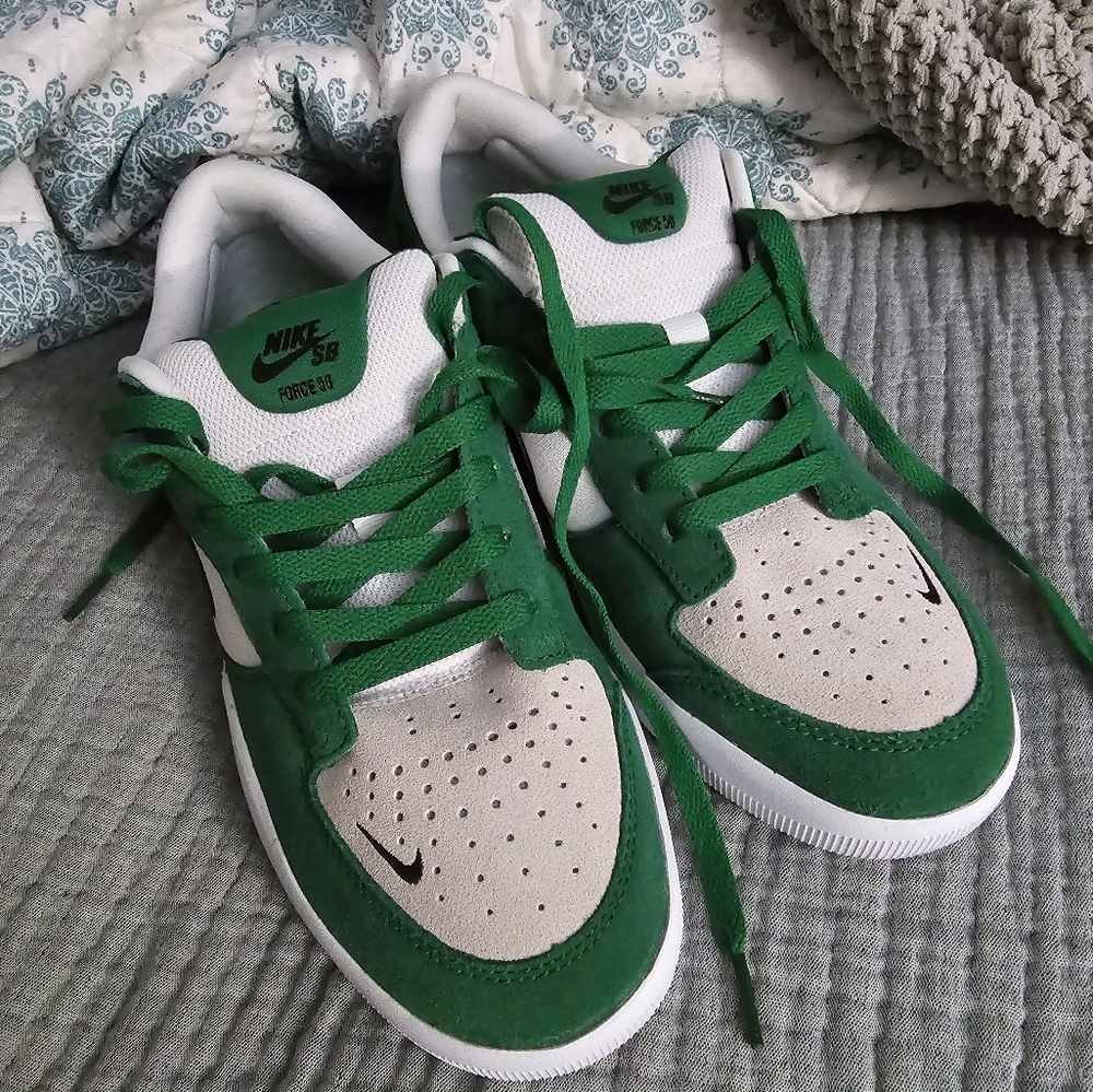 Nike athletic shoes. Green black and white.